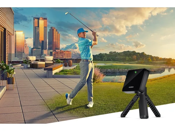 Garmin Approach R10 launch monitor set up behind a golfer